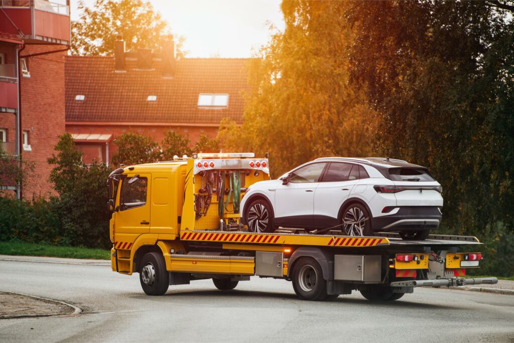 tow truck with broken car road tow truck transporting car highway car service transportation concept roadside rescue 1 Towing Company in Sudbury
